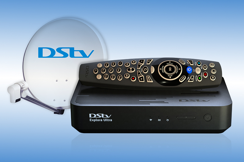 Accredited DSTV repair technician using satellite signal meter to diagnose dish alignment fault in Pretoria home